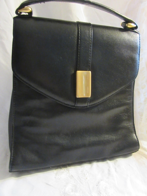 black leather handbag, top handle, brass closure,… - image 1