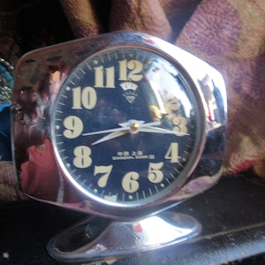 fabulous art deco alarm clock from Shanghai, 1930s pedestal alarm clock with calendar, works!! black background, white printing, chrome trim