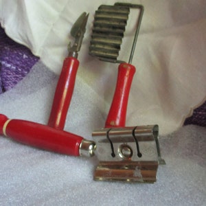 3 pieces old vintage kitchen utensils, red/white wood handles, 1940's kitchen tools, knife sharpener, crimper, can opener, desirable decor