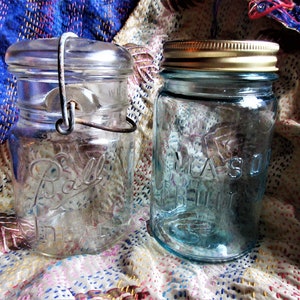 2 vintage canning/storage jars, Ball jar with glass lid and wire close, tinted Mason jar with screw lid, clear glass, excellent condition