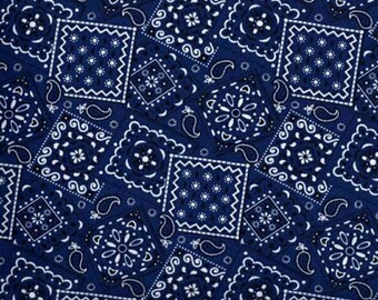May include: Blue and white bandana print fabric with a repeating pattern of paisley and diamond shapes. The fabric is measured with a ruler in inches.