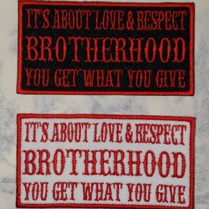 May include: Two rectangular embroidered patches. One is black with red text: "IT'S ABOUT LOVE & RESPECT BROTHERHOOD YOU GET WHAT YOU GIVE." The other is white with red text: "IT'S ABOUT LOVE & RESPECT BROTHERHOOD YOU GET WHAT YOU GIVE."