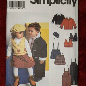 May include: Simplicity sewing pattern featuring children's clothing designs. The pattern includes illustrations of jackets, overalls, skirts, and vests. The cover shows a child wearing a yellow vest with heart details, a skirt, and boots. The pattern number is 9456.