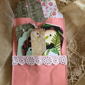 Pink junk journal pockets with tags