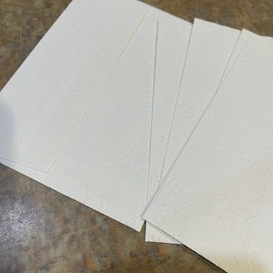 5 beautiful embossed envelopes