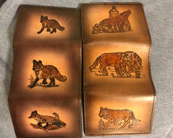 Handmade fox or wolf trifold leather wallet.