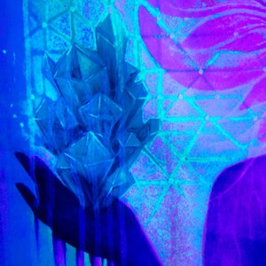 May include: A blue crystal cluster with a geometric pattern in the background. The crystal cluster is illuminated with a blue and purple light.