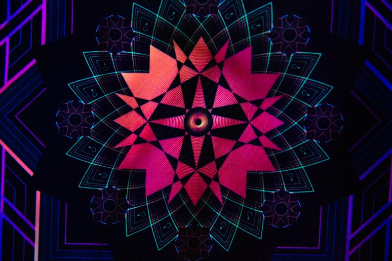 May include: Abstract digital art featuring a symmetrical design with a central eye-like shape. The artwork uses a palette of pink, orange, teal, and black, creating a vibrant and geometric pattern. The design has a psychedelic feel.