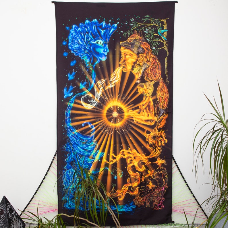 May include: A tapestry with a psychedelic design featuring a blue water spirit, a red fire spirit, and a green earth spirit. The spirits are surrounded by a golden sun with rays of light. The tapestry is on a white wall.