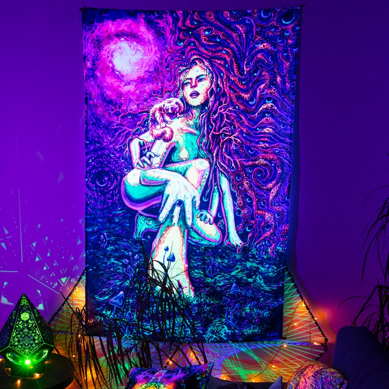 May include: A psychedelic tapestry featuring a woman with long flowing hair holding a small animal. The tapestry is a vibrant mix of pink, purple, blue, and green colors. The background is a swirling pattern of eyes and other abstract shapes.