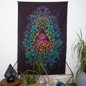 May include: A black tapestry with a rainbow-colored design of a lotus flower inside a triangle surrounded by a Celtic knot and floral patterns.