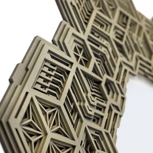 May include: A brown, intricate, layered, geometric design with a 3D effect. The design is made of multiple layers of wood, creating a complex and visually interesting pattern.