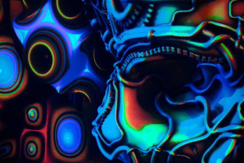 May include: Abstract digital art featuring a blue, green and red colour scheme. The image depicts a 3D design with a metallic, textured surface.