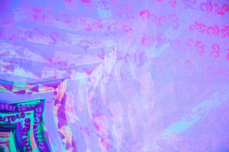 May include: Abstract digital art with a purple, pink, and blue color scheme. The image has a pixelated, glitched effect.