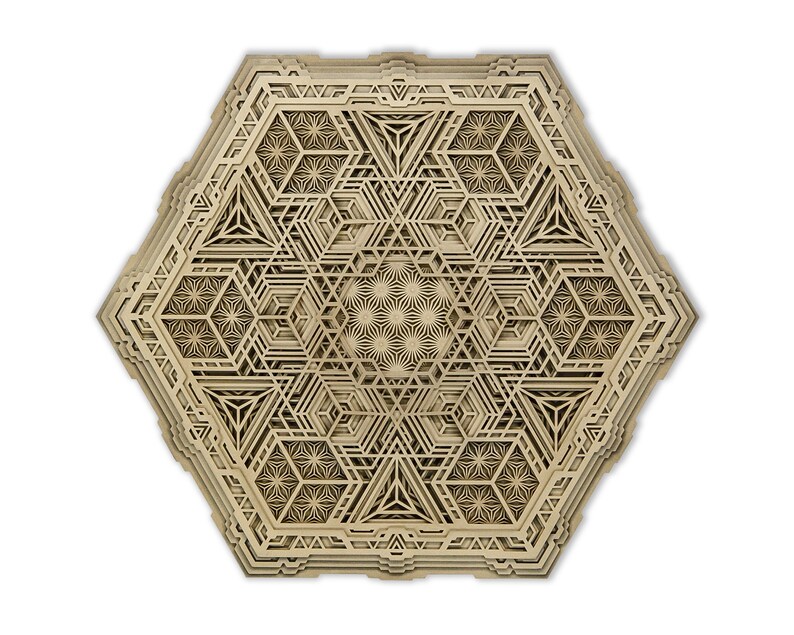 May include: A beige hexagonal wooden wall art piece with a layered geometric design. The design features intricate patterns and shapes, creating a visually complex and intricate piece.