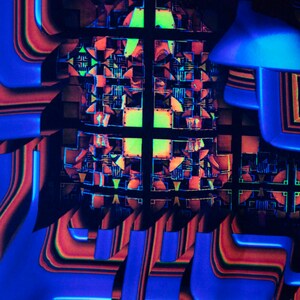 May include: Abstract geometric pattern with a grid of squares and rectangles in shades of red, orange, blue, and green. The pattern is layered and overlapping, creating a sense of depth and dimension.