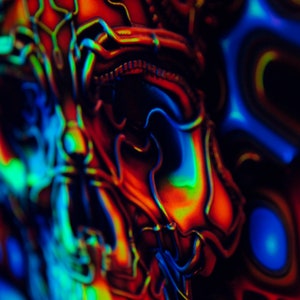 May include: Abstract art with swirling patterns in shades of blue, green, red, and orange.