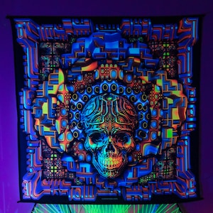 May include: A black tapestry with a psychedelic design featuring a glowing skull with intricate details. The skull is surrounded by geometric patterns in shades of blue, green, orange, and yellow. The tapestry has the word "OMNIORATA" printed at the bottom.