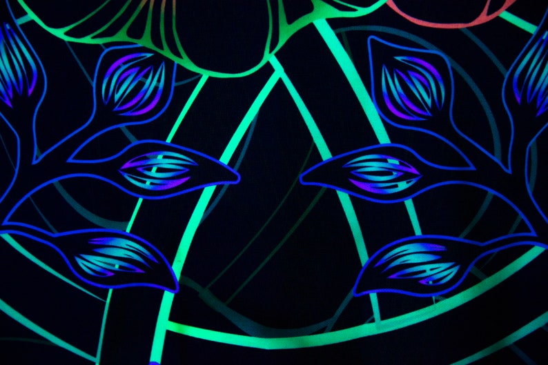 May include: A black background with a repeating pattern of blue and green floral designs. The design features stylized leaves and flowers with a glowing effect.