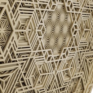 May include: A beige geometric pattern with a 3D effect, created by layering multiple layers of cut-out shapes. The pattern is made up of repeating hexagons and stars.