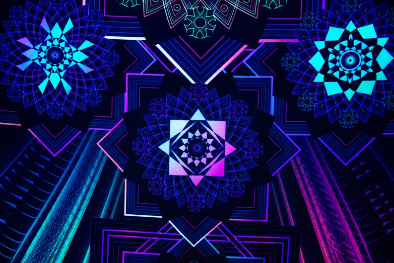 May include: Abstract digital art featuring geometric mandala designs in shades of blue, teal, and purple against a dark background. The symmetrical patterns create a vibrant, glowing effect, with sharp lines and intricate details.