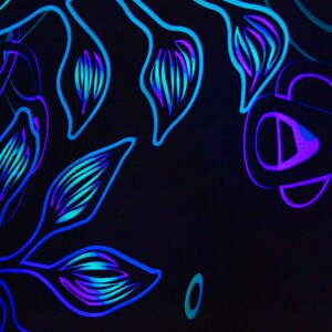May include: Abstract floral design with blue and purple lines on a black background.