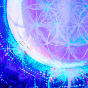 May include: A close-up of a purple and blue abstract painting with a white geometric design in the center. The design resembles a flower or a mandala.