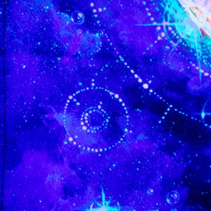 May include: A close-up of a blue and purple abstract painting with white dots and swirls. The painting has a galaxy-like appearance.
