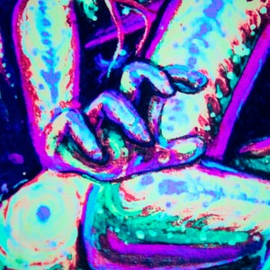 May include: A close-up of a vibrant, abstract painting with a mix of neon pink, blue, and green colors. The painting features swirling lines and shapes, creating a dynamic and energetic composition.