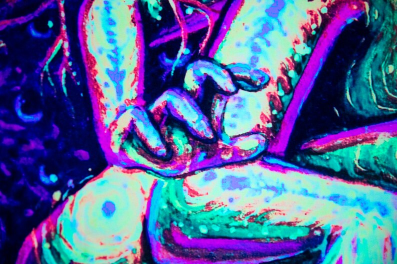May include: A close-up of a vibrant, abstract painting with a mix of neon pink, blue, and green colors. The painting features swirling lines and shapes, creating a dynamic and energetic composition.