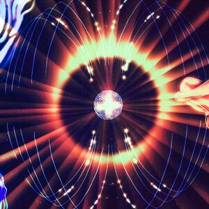 May include: Abstract digital art with a glowing orb in the center surrounded by radiating lines of light. The background is dark with hints of blue and red.