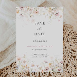 May include: A rectangular wedding invitation card with a floral watercolour design. The text "SAVE THE DATE" is at the top, with the date 08.24.2025 below. The names "MONICA & WILLIAM" and location "SAVANNAH, GEORGIA" are also included.