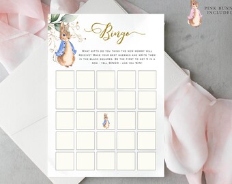 May include: A printable baby shower bingo card with a watercolor illustration of a bunny wearing a blue jacket. The card has 25 squares with blank spaces for guests to write down their guesses for gifts the new mom will receive. The text on the card reads "Bingo" and "What gifts do you think the new mommy will receive? Make your best guesses and write them in the blank squares. Be the first to get 5 in a row - yell Bingo - and you win!"