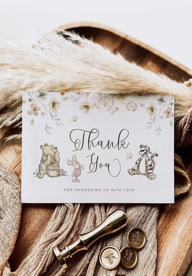 May include: Thank you card with Winnie the Pooh and Tigger characters. The card has a floral border and the text "Thank You" in cursive. The text "For showering us with love" is printed below the characters.