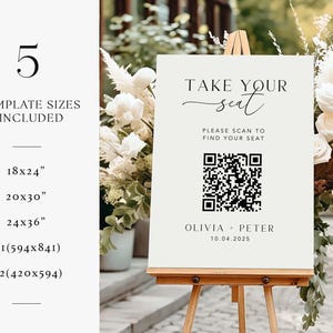 May include: A cream-colored wedding sign on a wooden easel with the text "TAKE YOUR seat". It includes a QR code and the names Olivia + Peter with the date 10.04.2025. The sign lists 5 template sizes: 18x24", 20x30", 24x36", A1(594x841), and A2(420x594).