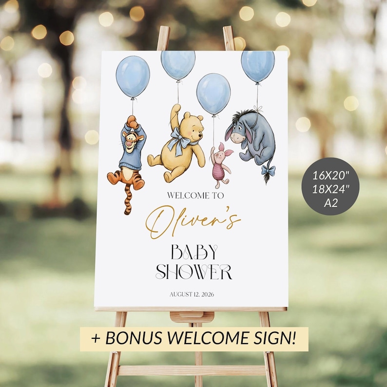 May include: A white baby shower sign on an easel features Winnie the Pooh characters holding blue balloons. The sign reads "Welcome to Oliver's Baby Shower" with the date August 12, 2026. Includes a bonus welcome sign.