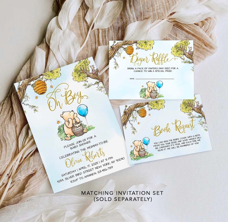 May include: A Winnie the Pooh themed baby shower invitation set with a blue and yellow color scheme. The invitation features a cartoon Winnie the Pooh holding a honey pot. The text on the invitation reads "Oh Boy!" and includes details for the baby shower. The set also includes a diaper raffle card and a book request card.