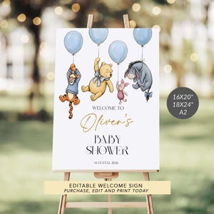 May include: A baby shower welcome sign on an easel, featuring Winnie the Pooh characters holding blue balloons. The sign reads "Welcome to Oliver's Baby Shower" with the date August 12, 2026. Available in 16x20", 18x24", and A2 sizes.