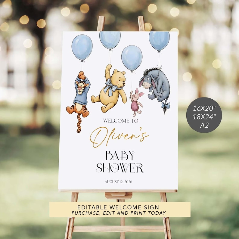 May include: A baby shower welcome sign on an easel, featuring Winnie the Pooh characters holding blue balloons. The sign reads "Welcome to Oliver's Baby Shower" with the date August 12, 2026. Available in 16x20", 18x24", and A2 sizes.