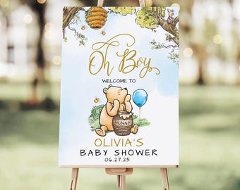 May include: A rectangular sign featuring a Winnie the Pooh illustration with a beehive, a blue balloon, and the text: Oh Boy, WELCOME TO, OLIVIA'S BABY SHOWER, 06.27.25. The design includes a honey pot labeled HUNNY and a small piglet character.