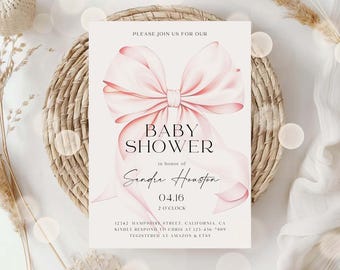 May include: A rectangular baby shower invitation card featuring a large, soft pink satin bow illustration. The text reads: PLEASE JOIN US FOR OUR BABY SHOWER in honor of Sandra Houston 04.16 2 O'CLOCK 12342 HAMPSHIRE STREET, CALIFORNIA, 123-456-7809.