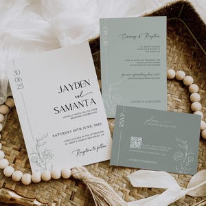 May include: A wedding invitation suite with a light blue and white color scheme. The invitation features a floral design and the text "Jayden and Samanta" in a modern font. The RSVP card includes a QR code and the text "Please respond by May 15th".