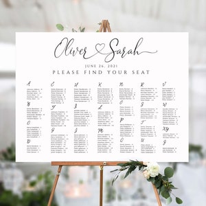May include: A wedding seating chart with the names of guests listed alphabetically. The chart is printed on white paper and has a black and white design. The text at the top of the chart reads "Oliver & Sarah" and "June 26, 2021" and "Please Find Your Seat".