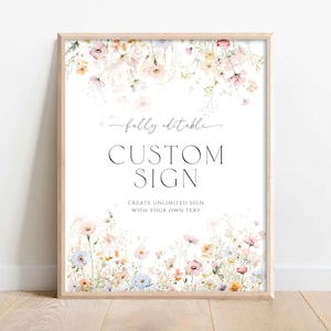Peut inclure: Une affiche rectangulaire dans un cadre en bois clair ornée d'illustrations à l'aquarelle de fleurs sauvages roses, jaunes et bleues en haut et en bas. Le texte indique fully editable CUSTOM SIGN CREATE UNLIMITED SIGN WITH YOUR OWN TEXT.