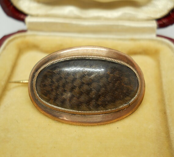 Georgian gold brooch set with mourning hair work c