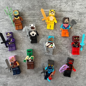 May include: A collection of 11 colorful Minecraft minifigures, each with unique accessories and designs. The figures include a panda, a creeper, a zombie, a skeleton, a spider, a pig, a cow, a sheep, a chicken, a wolf, and a villager.