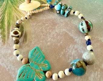 Boho-armband met vlinderbedel