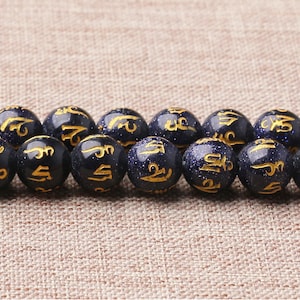 Hilo de cuentas sueltas redondas OM mani padme hum de piedra arenisca azul sintética tallada, 16'', 8 mm, 10 mm y 12 mm