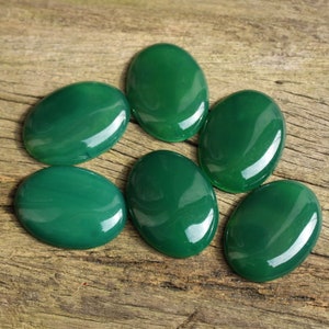 May include: Six smooth, oval-shaped green agate stones. The stones are polished and have a glossy finish.