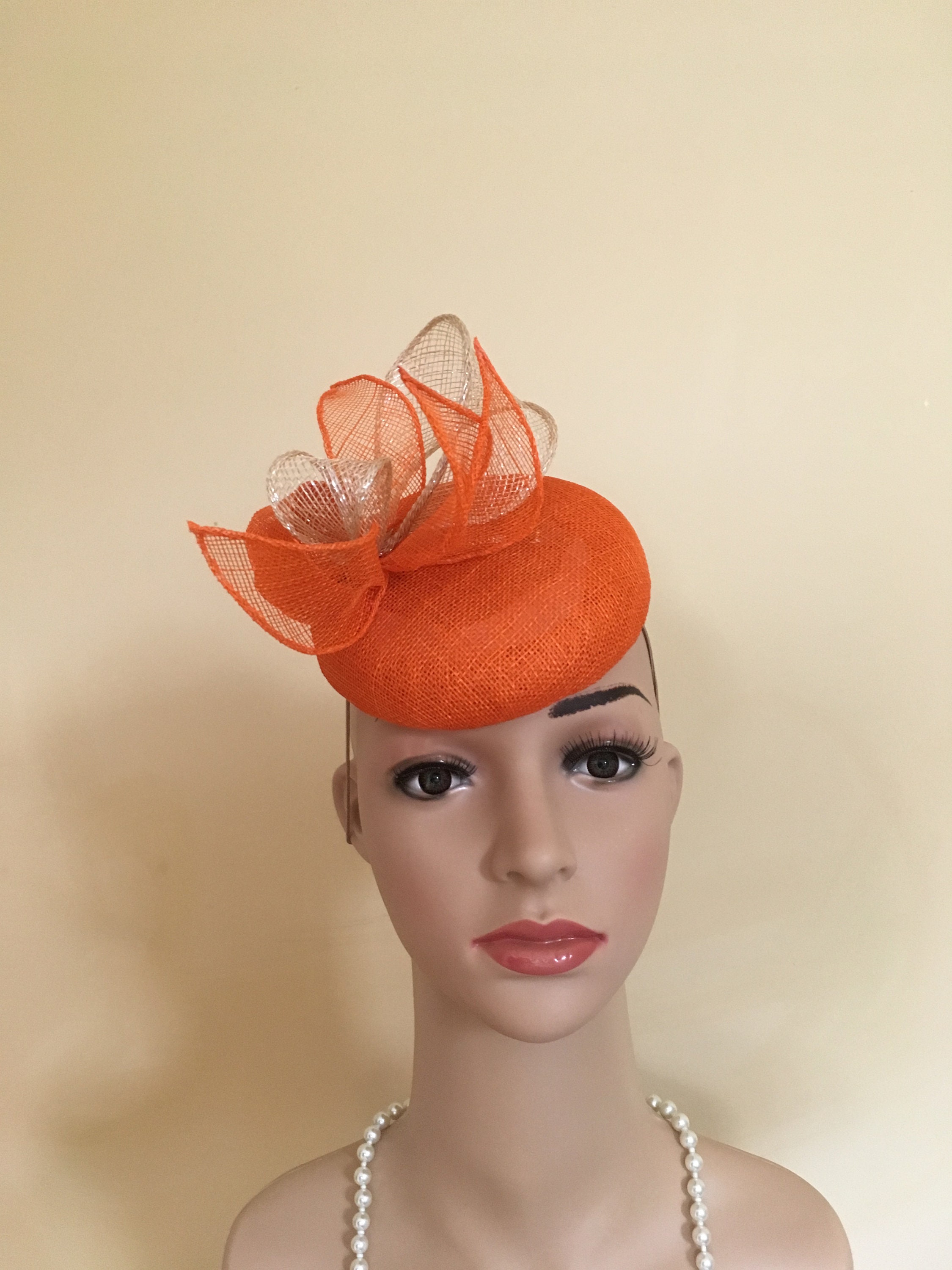 orange hats and fascinators